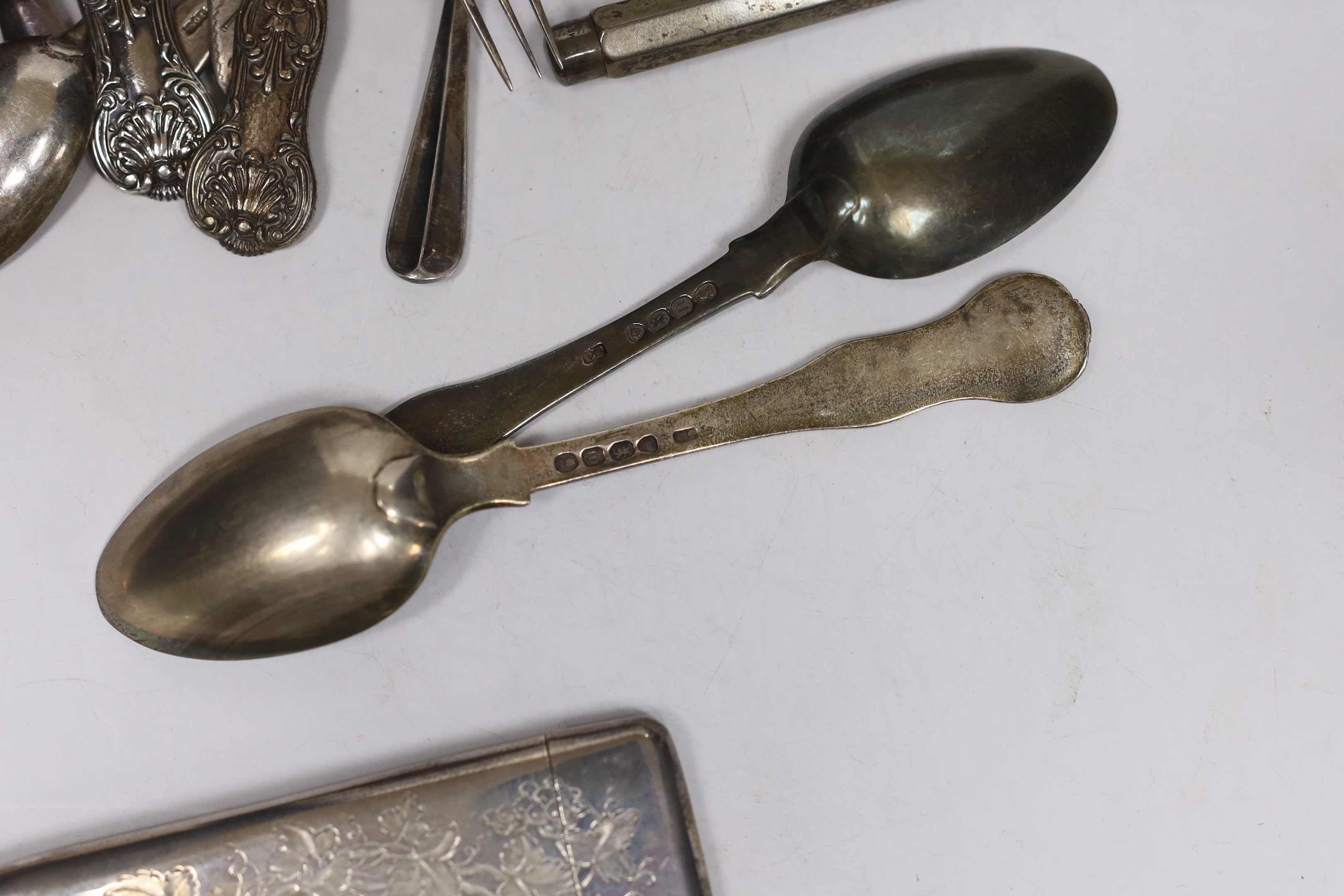 A late Victorian engraved silver rectangular card case, London, 1883, 9.9cm, eighteen items of assorted silver flatware including a set of six George IV silver Queens pattern teaspoons,1827/8, a silver pencil and a tenni